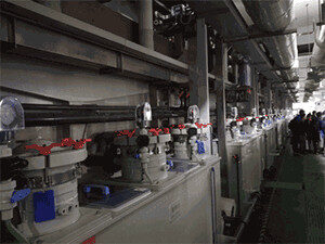 Automated plating line for plated through hole (PTH) and copper deposition on circuit boards.